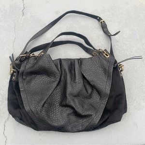 Free People pebbled leather and cowhide fur bag